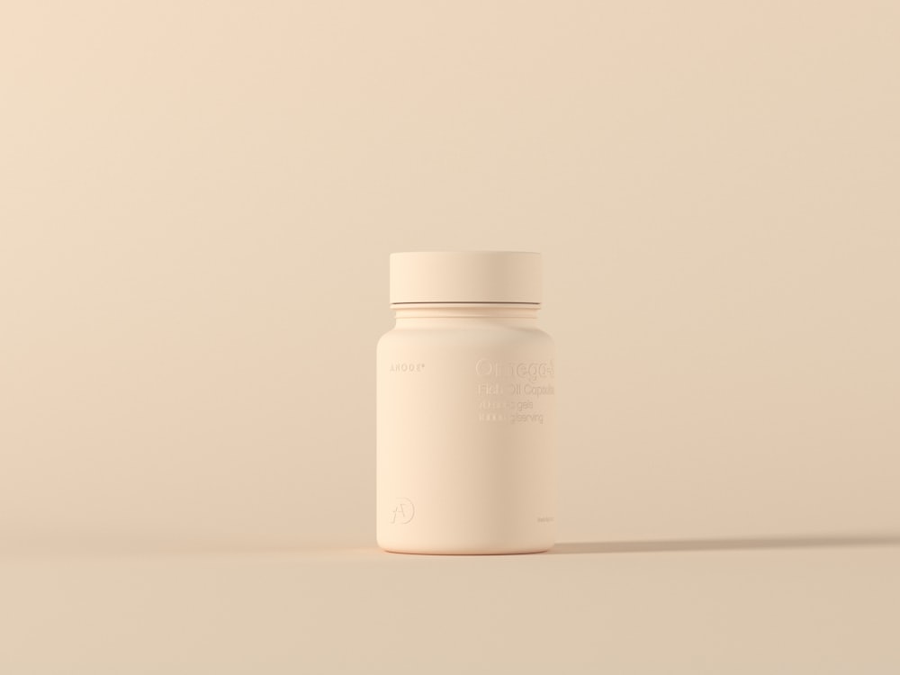 Single unbranded cosmetic jar on a neutral beige background