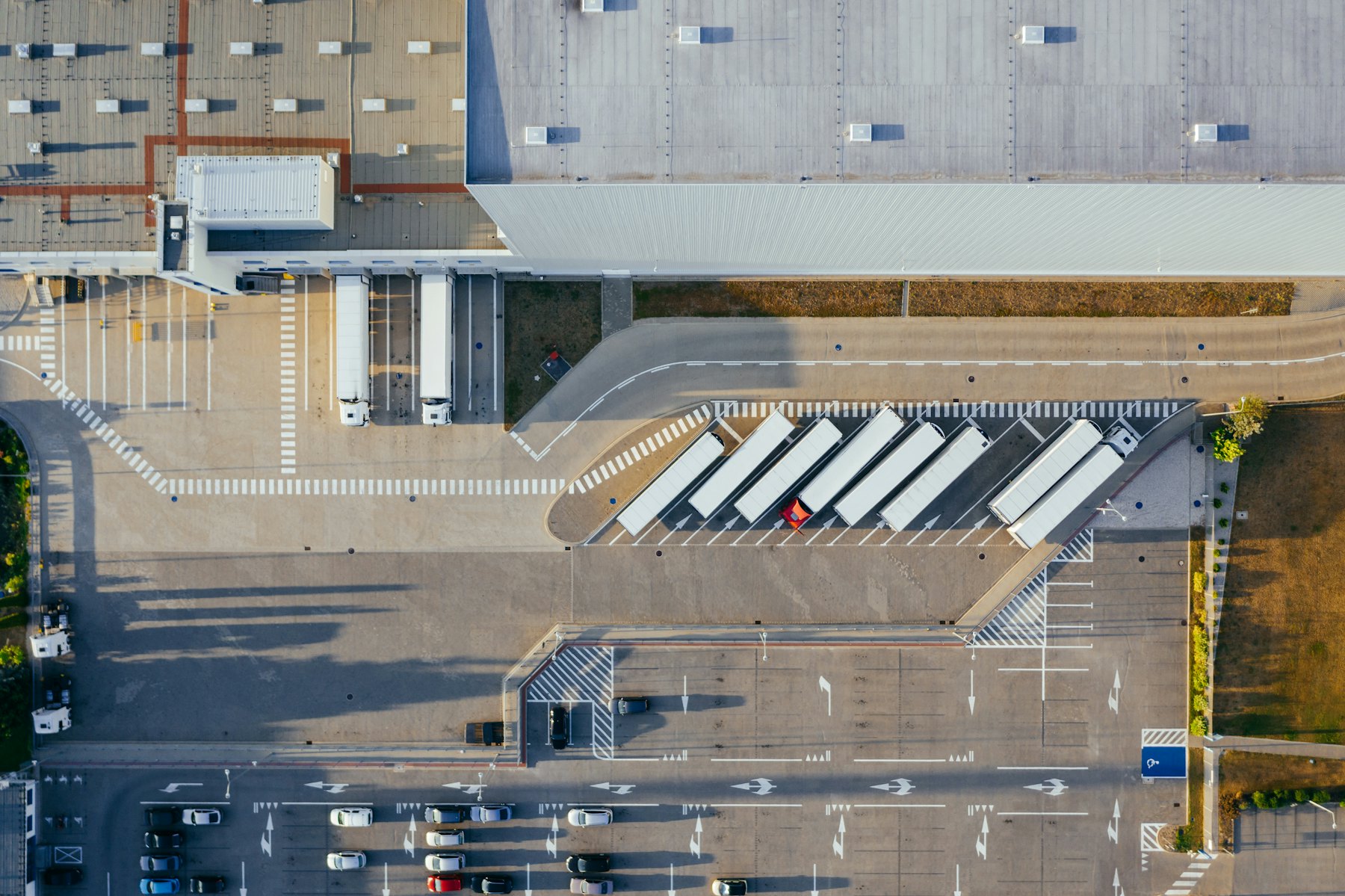 Aerial view of a distribution centre with loading bays and articulated lorries